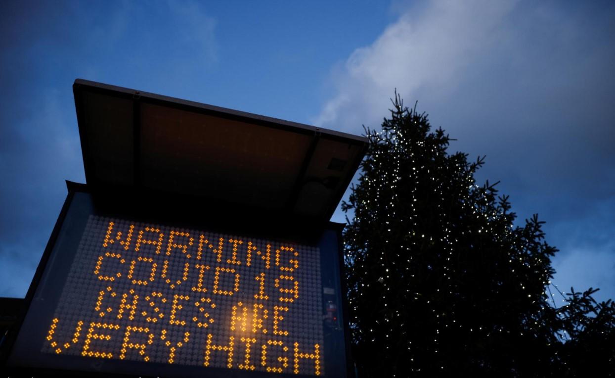 An electronic sign displays information as the British government imposes a stricter tiered set of restrictions amid the coronavirus disease (COVID-19) pandemic, in London, Britain, December 20, 2020. - Avaz