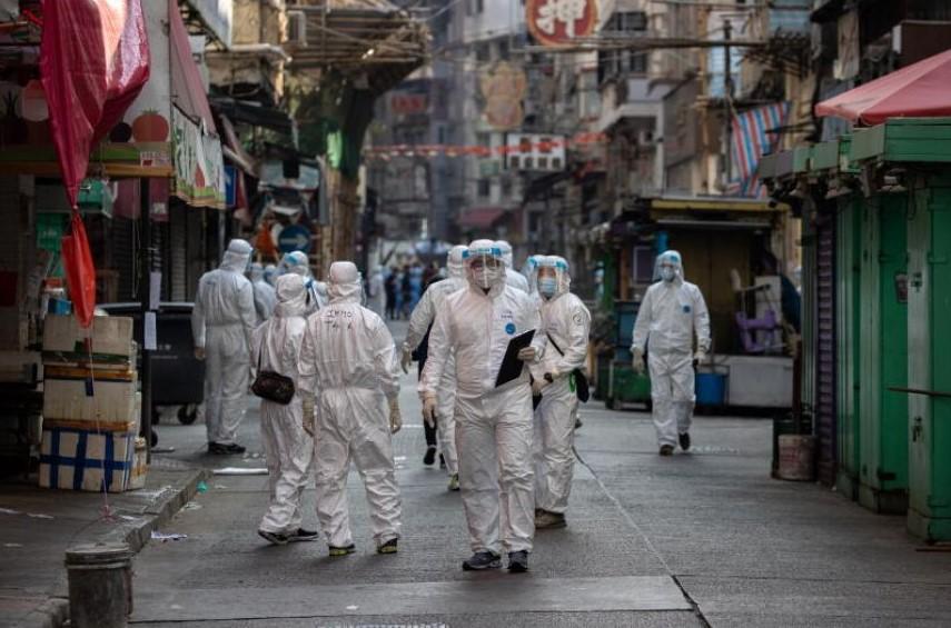 Civil servants in protective face masks and gowns enforcing a lockdown in Jordan, Hong Kong, on Jan 23, 2021. - Avaz