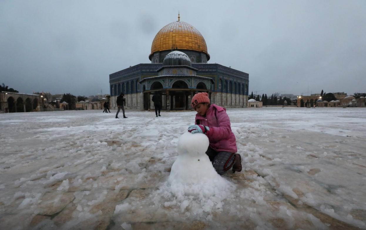 Jerusalem's Old City turns white after rare snowfall