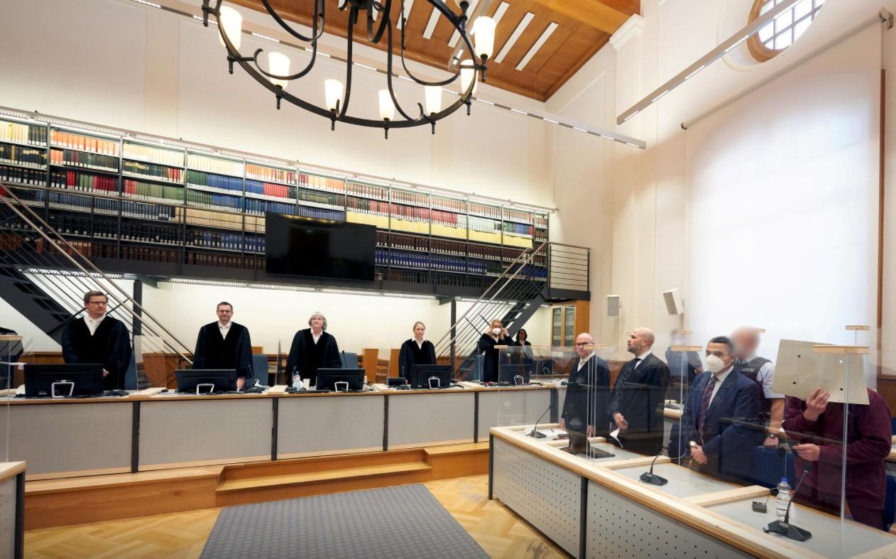 Presiding judge Anne Kerber stands before handing the verdict to Syrian defendant Eyad A. (R) in the courtroom in Koblenz, Germany February 24, 2021. - Avaz