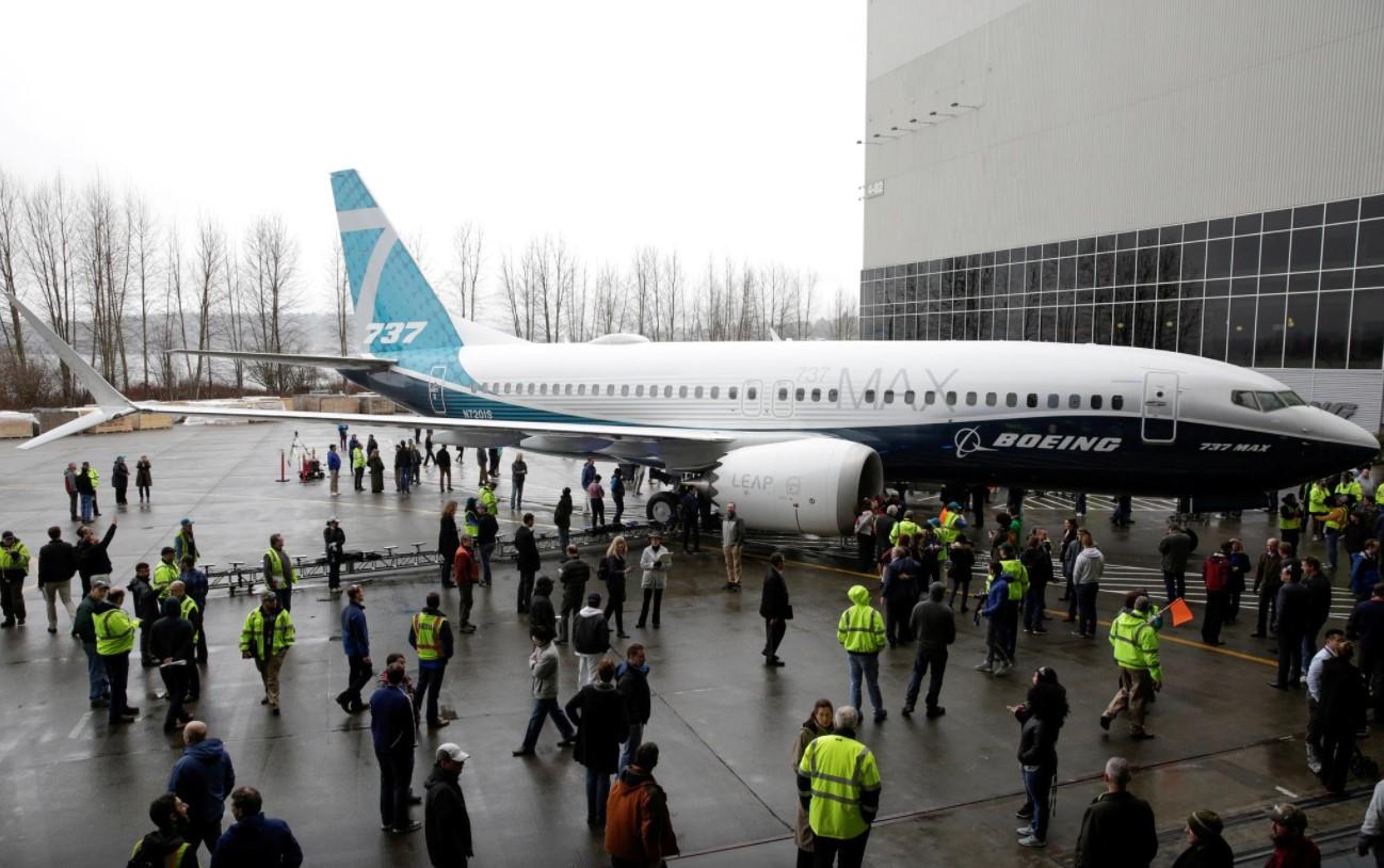 Employees are pictured as the first Boeing 737 MAX 7 is unveiled in Renton, Washington, U.S. February 5, 2018. - Avaz