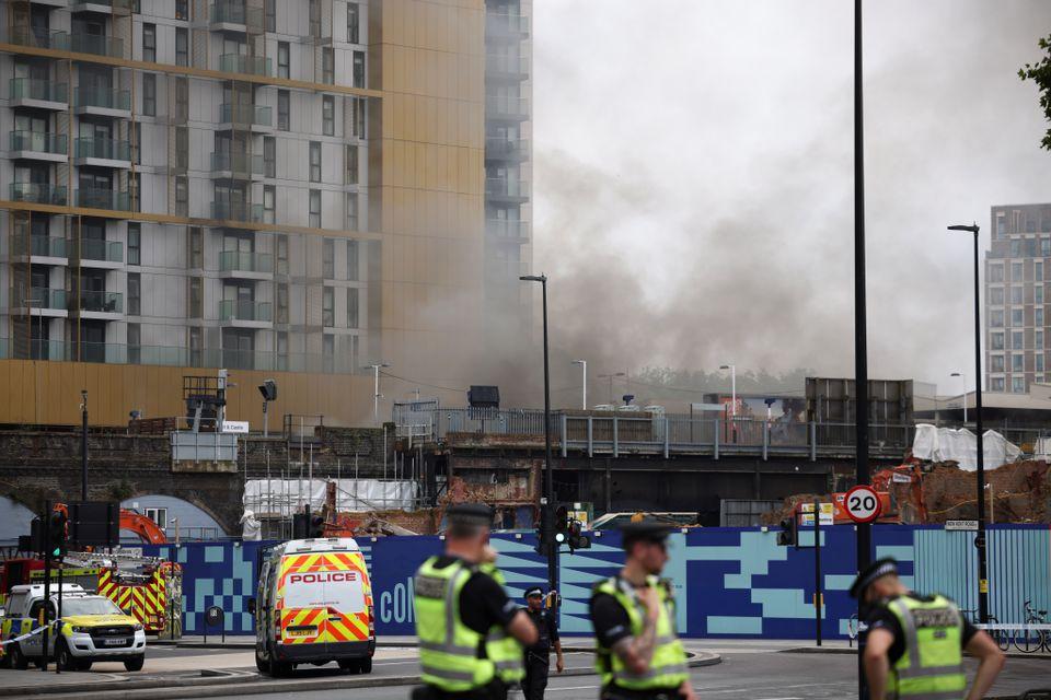 Emergency crews attend to a scene of fire near the Elephant and Castle train station in London, Britain June 28, 2021. - Avaz