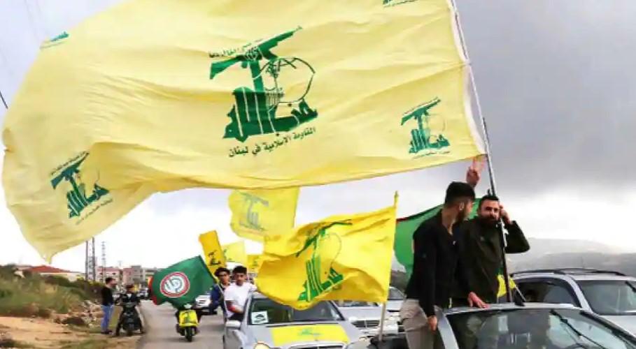 A Hezbollah flag flutters in Lebanon Photograph - Avaz